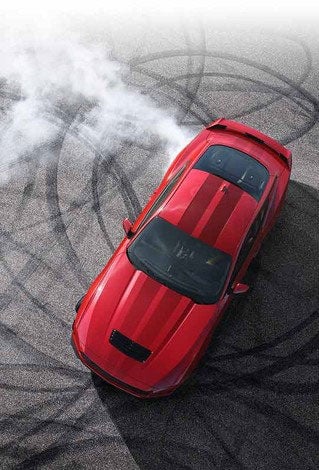 Overhead view of a 2024 Ford Mustang® model with tire tracks on pavement | Birdnow Motor Trade in Oelwein IA
