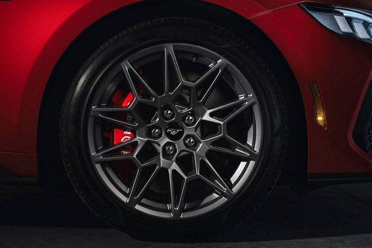 2024 Ford Mustang® model with a close-up of a wheel and brake caliper | Birdnow Motor Trade in Oelwein IA
