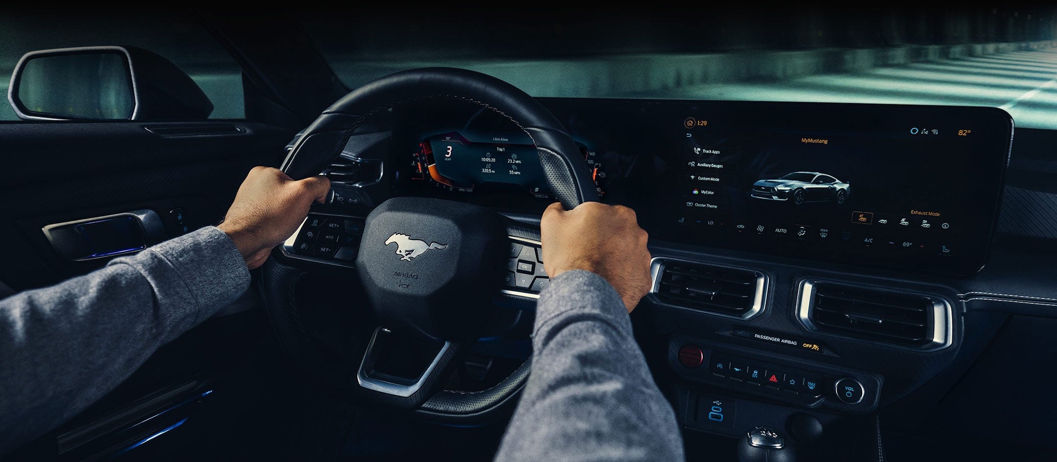 A 2024 Ford Mustang® model interior with a person driving | Birdnow Motor Trade in Oelwein IA
